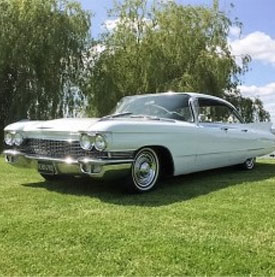 Cadillac vintage car in field for display