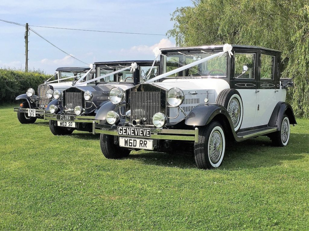 3 vintage and classical cars, wedding cars, with bows and sashs
