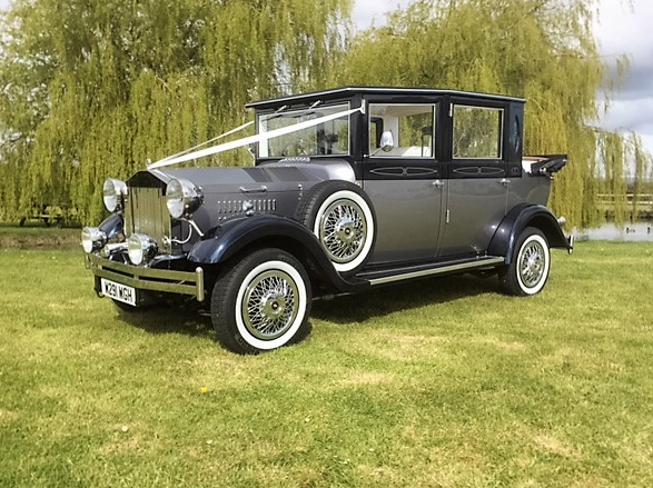 Viscount Vintage custom built car for wedding hire with bows and ribbons 