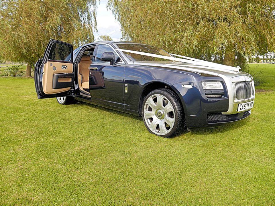rolls royce ghost car with ribbons and door opened