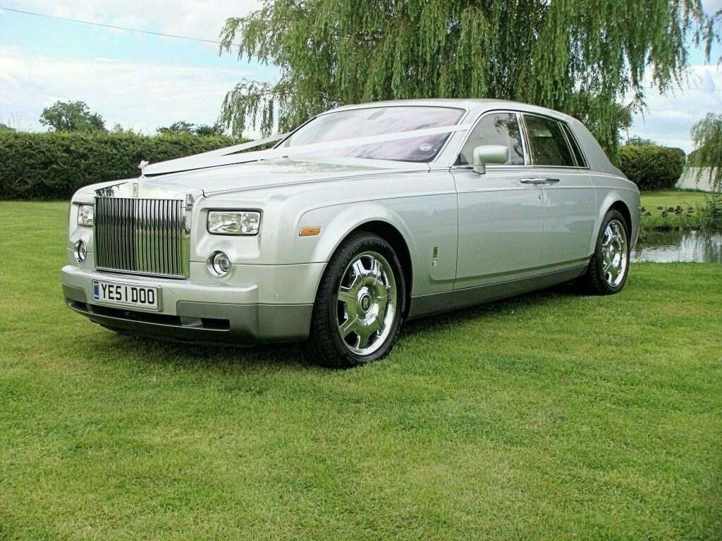 rolls royce phantom next to lake