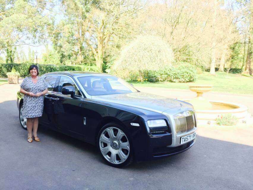 Rolls Royce wedding car with white ribbon adn white finish